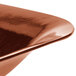 A close up of a Tablecraft copper square bowl.