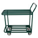 A green Winholt metal stocking cart with two shelves and wheels.