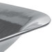 A Tablecraft gray cast aluminum square bowl with a shiny surface and curved edge.
