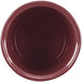 A close-up of a red Tablecraft salad dressing bowl with a maroon speckled rim.