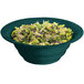 A Tablecraft hunter green and white speckled cast aluminum salad bowl filled with salad on a table.