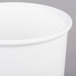 A white cast aluminum bowl with a lid.
