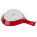 A Tuxton red and white fry pan server with a white handle.