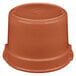 A brown plastic lid on a brown pot.