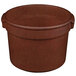 A brown cast aluminum pot with a handle.