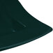 A Tablecraft hunter green and white speckled cast aluminum platter with a curved edge.