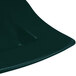 A close-up of a dark green Tablecraft cast aluminum platter with a curved edge.