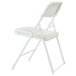 A white National Public Seating metal folding chair with a white seat.
