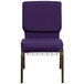 A close-up of a Flash Furniture Royal Purple church chair with a gold vein metal frame and a communion cup book rack.