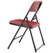A red National Public Seating folding chair with black legs and frame.