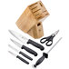A Victorinox knife block with several knives, a knife, and scissors with black handles.