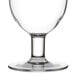 A clear plastic Thunder Group Hurricane Glass with a small base.