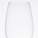 A clear Thunder Group plastic wine glass on a white surface.