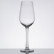 A close-up of a clear Thunder Group plastic wine glass.