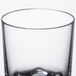A clear plastic Thunder Group Classic Rocks glass with a thin rim.