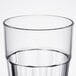 A close up of a clear Thunder Group polycarbonate tumbler.