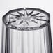 A close up of a clear Thunder Group Diamond polycarbonate tumbler with a star design.