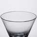 A clear plastic cocktail glass with a black rim.