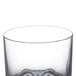 A clear plastic Thunder Group Classic Rocks glass with a design on the bottom.