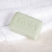 A Lava bar of soap with text on it on a white towel.