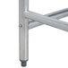 The open metal base of an Advance Tabco stainless steel work table.