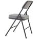 A black metal National Public Seating folding chair with a charcoal gray cushion.
