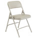 A gray National Public Seating folding chair with a warm gray padded seat.