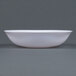 A Fineline Renaissance white bowl on a gray surface.