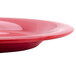 A close-up of a red GET Red Sensation wide rim plate.