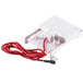 A white plastic box with a red wire.