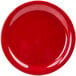 A red GET Red Sensation narrow rim plate with small black specks.