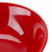 A close up of a red GET Red Sensation melamine bowl.