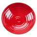 A red melamine bowl with a spiral design.