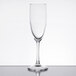 An Arcoroc Rutherford champagne flute with a stem on a white background.