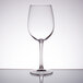 An Arcoroc Rutherford tall wine glass on a table.