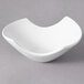 A white 10 Strawberry Street Whittier samurai bowl on a gray surface.
