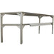 A stainless steel Delfield double overshelf above a metal table.