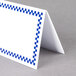 A white rectangular deli tent sign with a blue checkered border.