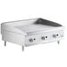A Cooking Performance Group stainless steel gas countertop griddle with manual controls.