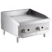 A Cooking Performance Group stainless steel gas countertop griddle with manual controls.