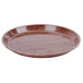 A round Cambro Country Oak fiberglass tray with a brown rim.