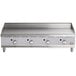 A Cooking Performance Group stainless steel gas countertop griddle with three burners.