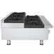 A stainless steel APW Wyott countertop range with six burners.