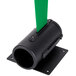 A black cylinder with a green strap attached to it.