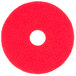 A red circular Scrubble floor buffing pad.