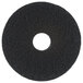 A black circular Scrubble by ACS stripping floor pad with a white circle in the center.