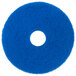 A blue circular Scrubble cleaning pad with a hole in the middle.