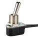 A black toggle switch with a silver metal handle.