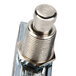 A close-up of a Nemco push button switch with a silver knob on top.