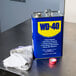 A can of WD-40 Heavy Duty Lubricant on a table.